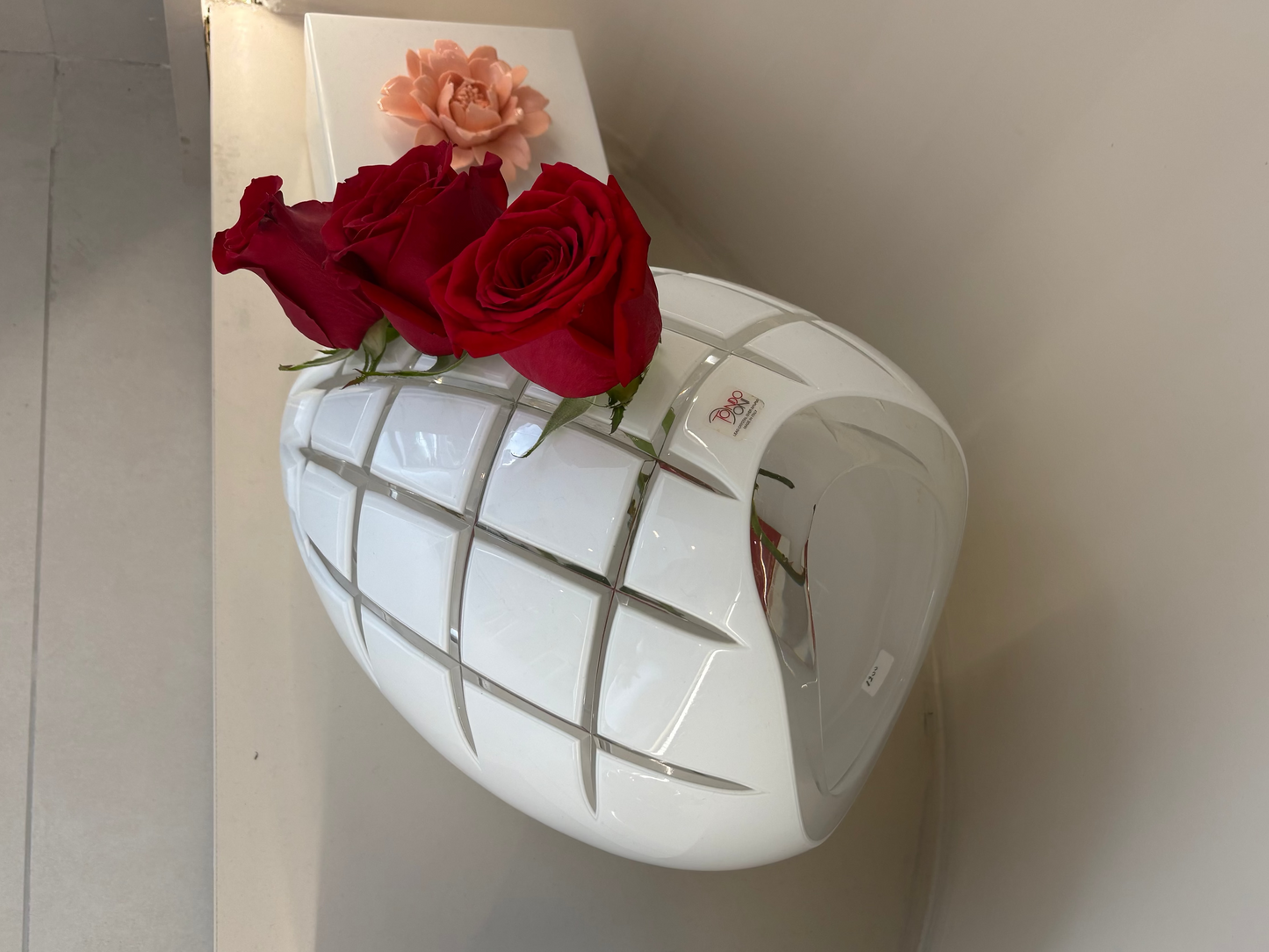 Decorative light fixture with flowers on a white surface